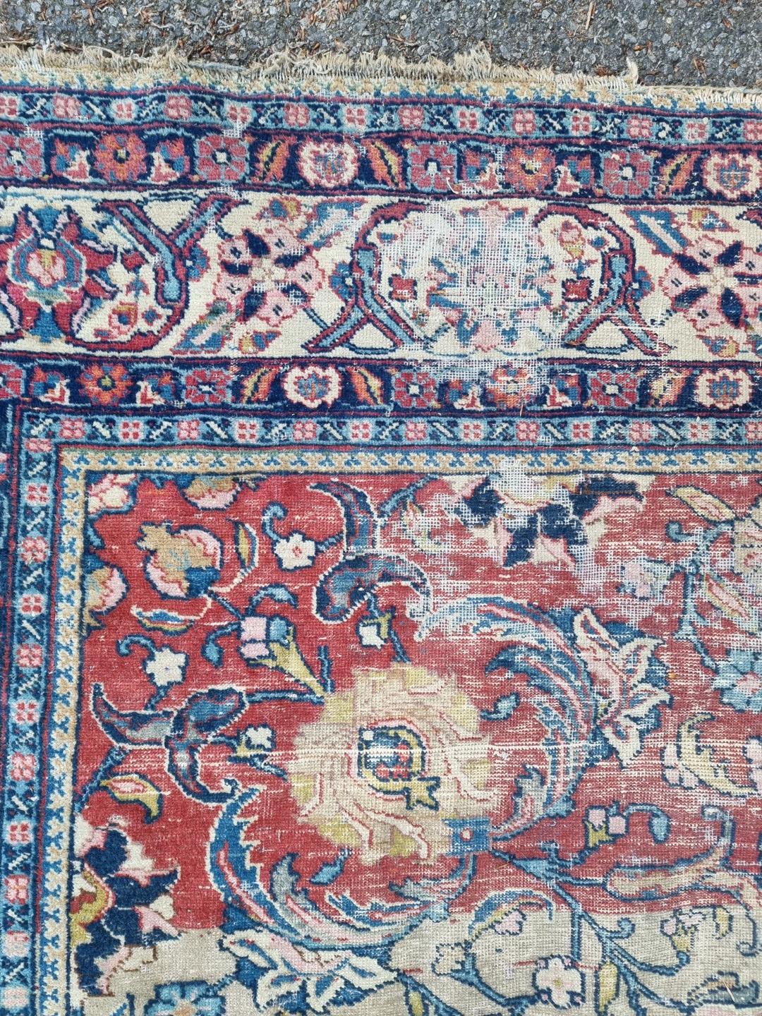 A Persian carpet, having central floral medallions, with floral cartouches to each corner of central - Image 7 of 10
