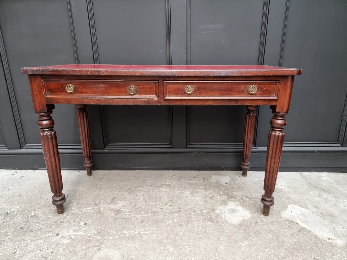 A 19th century mahogany desk, stamped 'M Willson, Great Queen St', 120.5cm wide.