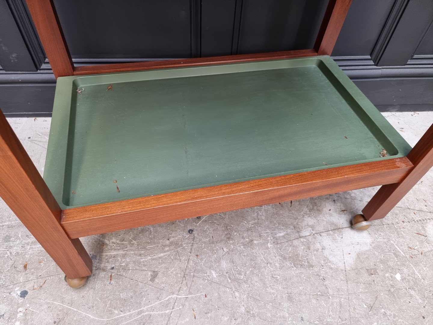 A mid-century teak two tier trolley, with removable green plastic trays, 76.5cm wide. - Image 3 of 3