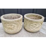 A large pair of composition stone planters, 43cm high x 53.5cm diameter.