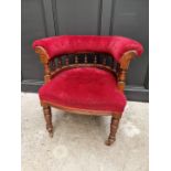A late Victorian walnut and button upholstered desk chair.