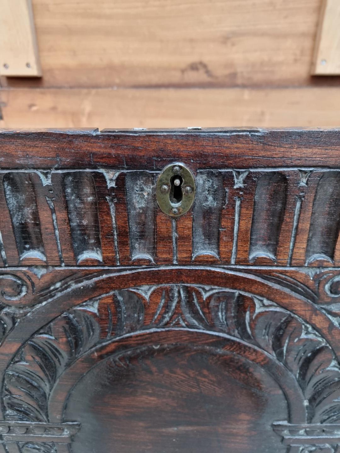 An early 18th century carved elm boarded coffer, 118.5cm wide. - Image 6 of 9