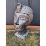 An Egyptian style stone or pottery bust, on marble base, 22cm high; together with a Chinese brass