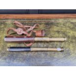Two brass and leather three drawer telescopes. (2)