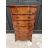 A reproduction mahogany bowfront chest of drawers, 62cm wide.