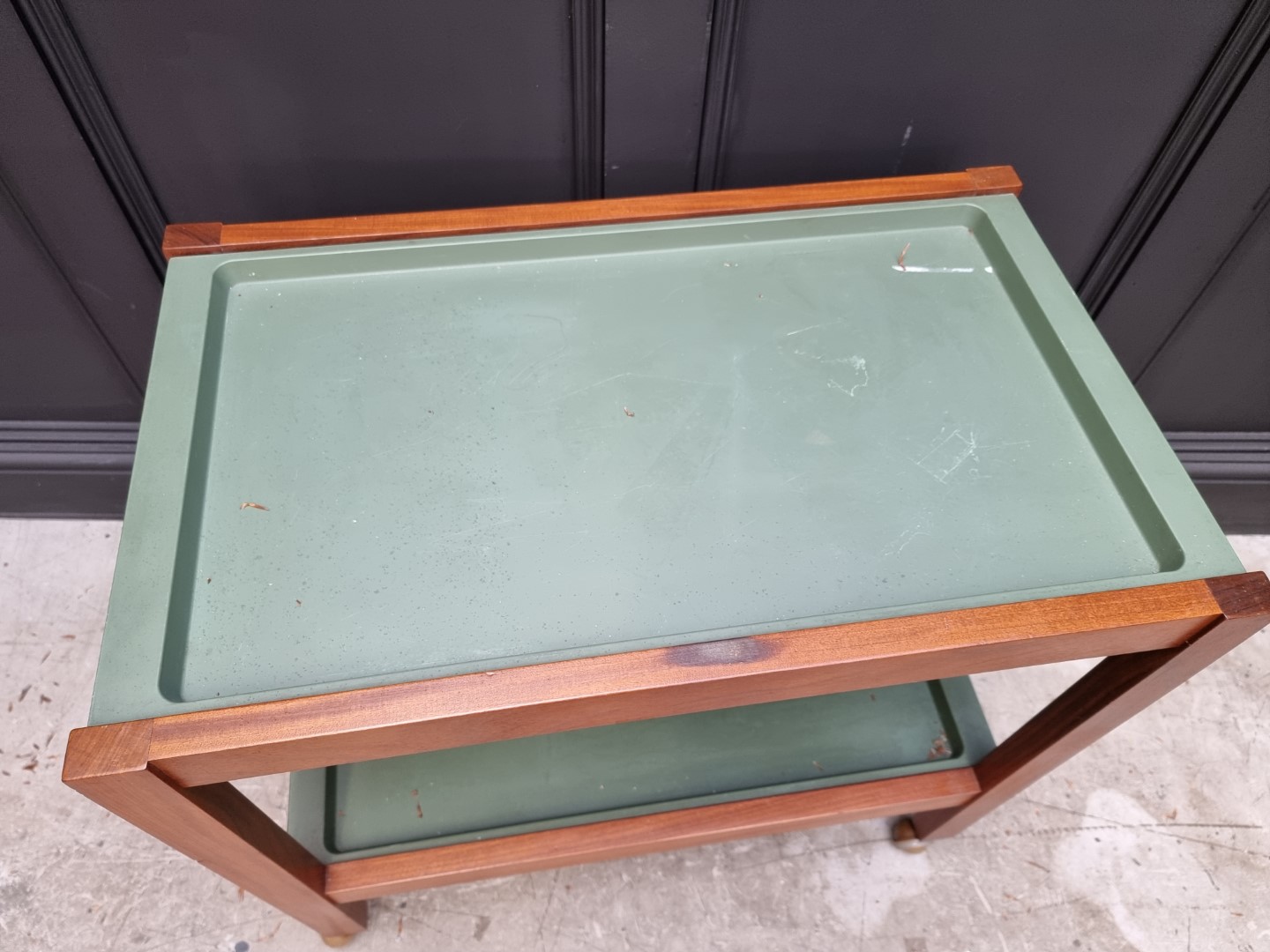 A mid-century teak two tier trolley, with removable green plastic trays, 76.5cm wide. - Image 2 of 3