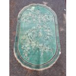 An antique Chinese oval rug, 220 x 136cm.