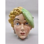 A Beswick Art Deco wall mask, 23.5cm high.