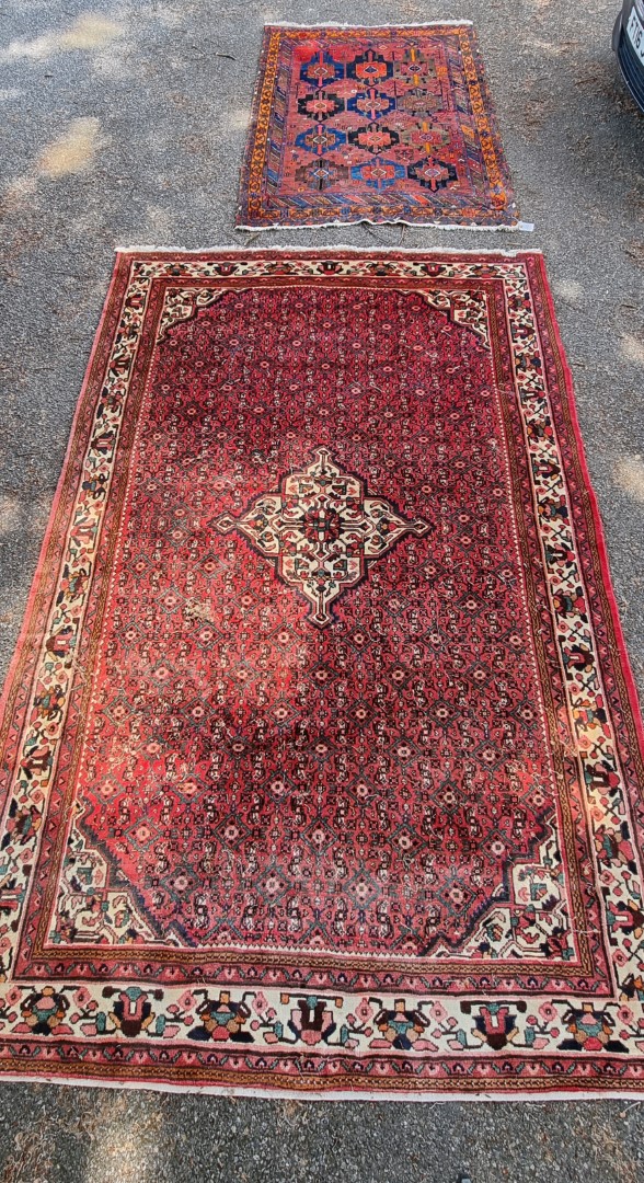 A Persian carpet, having central floral medallion, with floral decoration to central field, 392 x