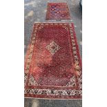 A Persian carpet, having central floral medallion, with floral decoration to central field, 392 x