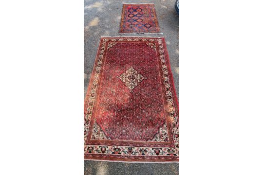 A Persian carpet, having central floral medallion, with floral decoration to central field, 392 x - Image 1 of 12