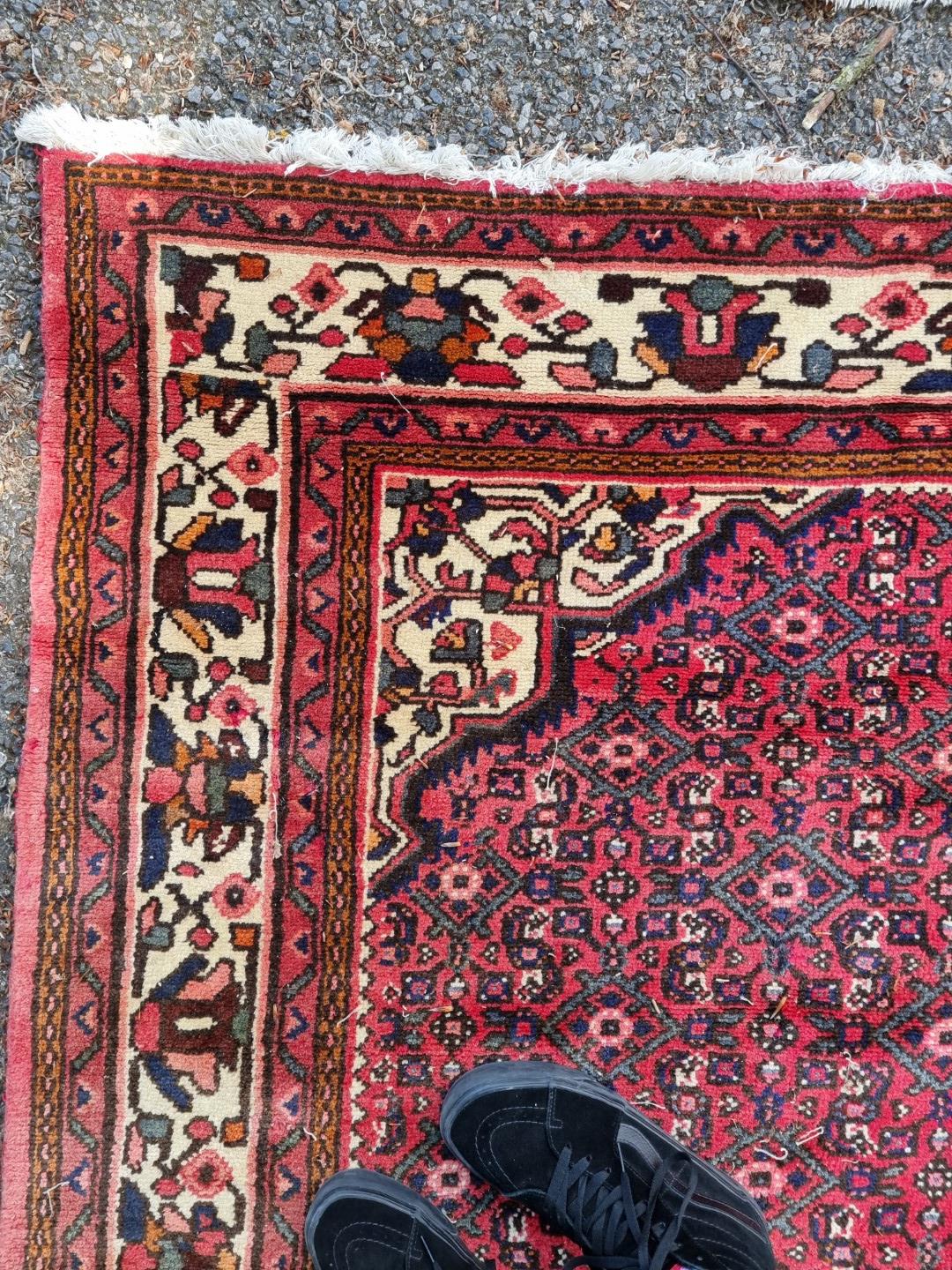 A Persian carpet, having central floral medallion, with floral decoration to central field, 392 x - Image 7 of 12