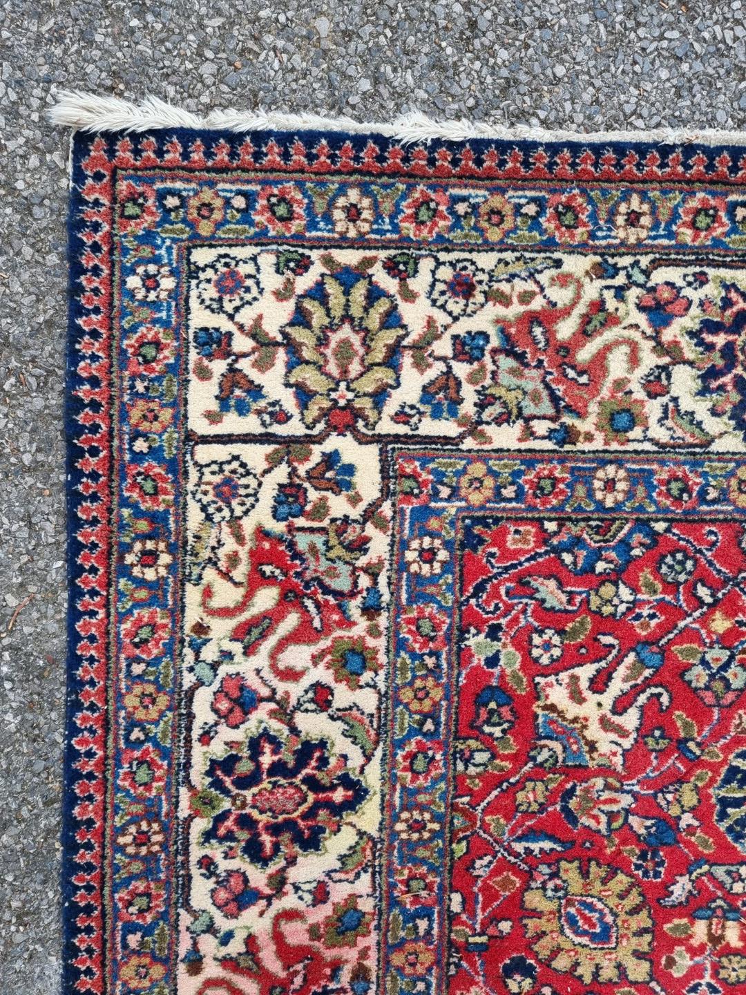 A Persian carpet, having allover floral decoration to central field, with floral borders, 295 x - Image 5 of 6