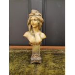 An Art Nouveau pottery bust, probably Austrian, 24.5cm high; together with another blanc de chine