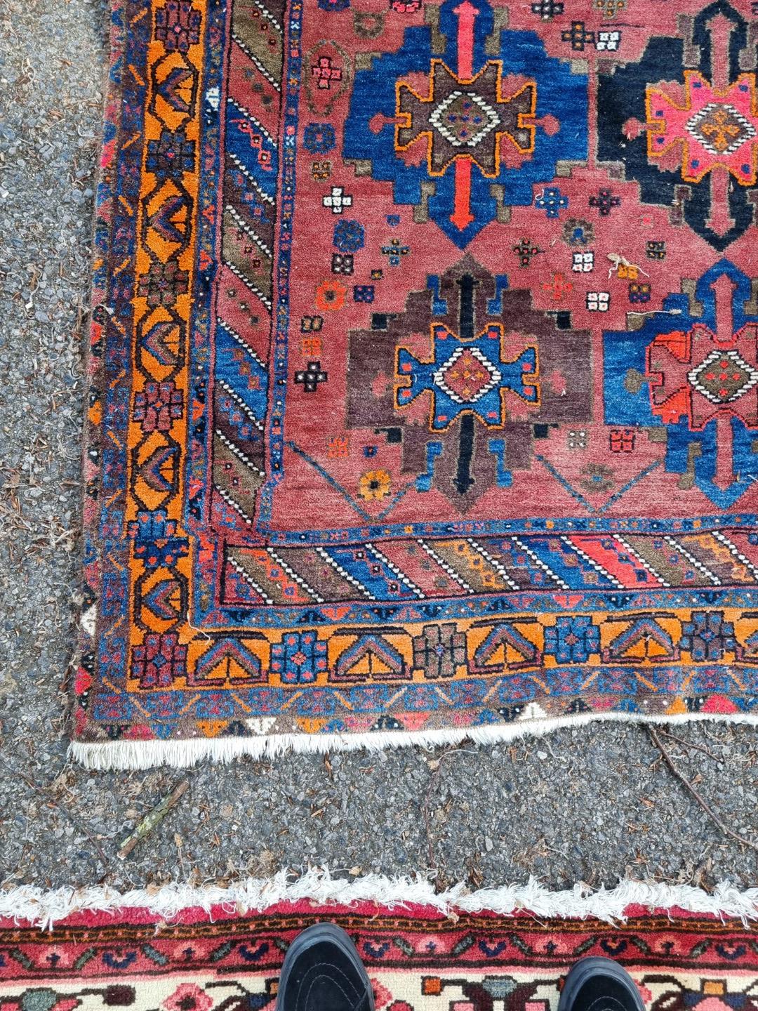 A Persian carpet, having central floral medallion, with floral decoration to central field, 392 x - Image 8 of 12