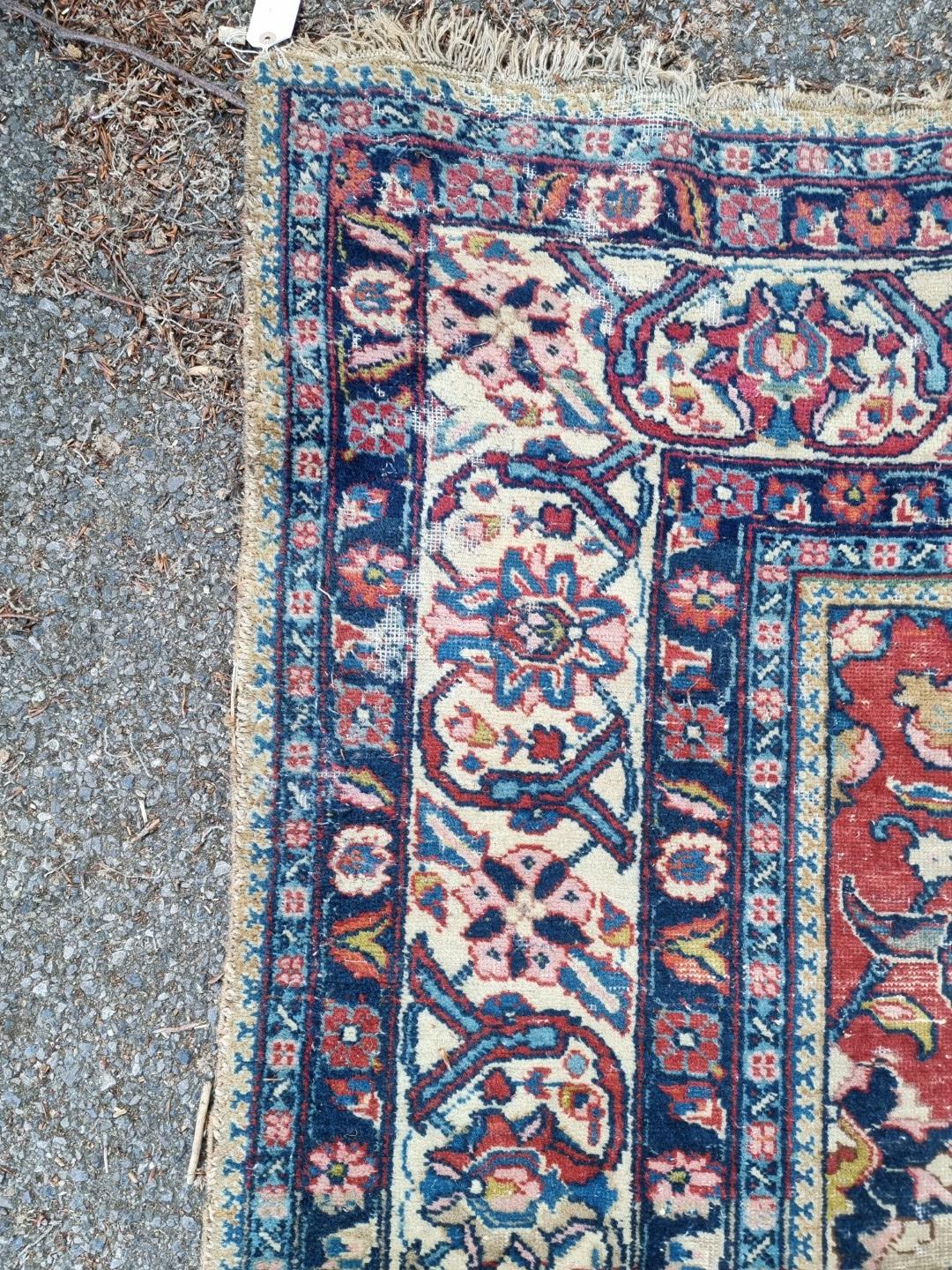 A Persian carpet, having central floral medallions, with floral cartouches to each corner of central - Image 8 of 10