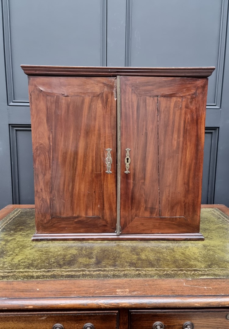 An 18th century mahogany table cabinet, enclosing pigeonholes and small drawers, 61cm high x 64.