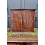An 18th century mahogany table cabinet, enclosing pigeonholes and small drawers, 61cm high x 64.