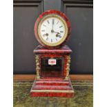 A late 19th century red tortoiseshell and brass mounted mantel clock, 34cm high, with pendulum.