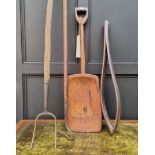 Antique Tools: a beech leather vice; together with a malt shovel; piecroft crook; and a pitchfork.