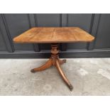 A 19th century oak tilt top tripod table, 81cm wide.