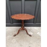 A George III mahogany pie crust tilt top tripod table, with one piece top, 75cm wide.