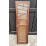 An antique oak gun cabinet, having glazed door, 152.5cm high x 44cm wide.