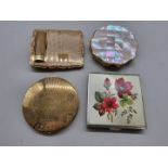 Four vintage compacts, to include a Stratton combined compact and lipstick; and a further Kigu