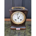 A late 19th century French marquetry mantel clock, 21.5cm high, with pendulum.