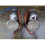 A pair of Art Deco chrome wall mounted cabin lights, each with mahogany shield mount, total height