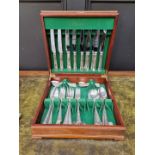 A mahogany cased part canteen of electroplated cutlery, for eight place settings, by Elkington.