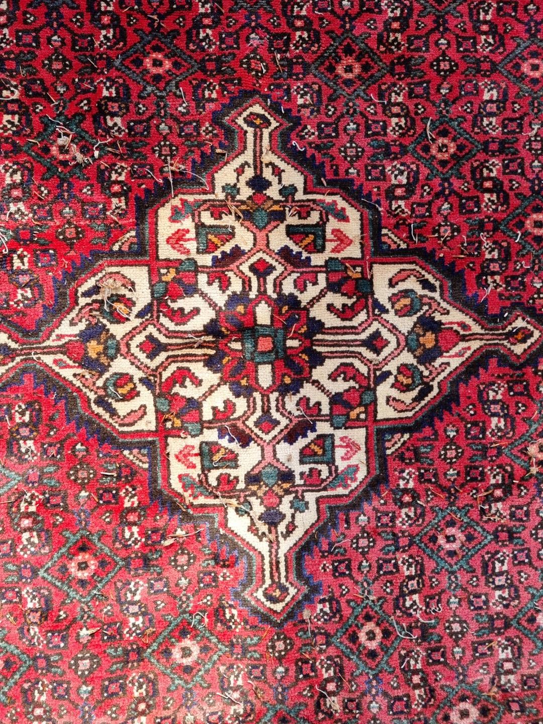 A Persian carpet, having central floral medallion, with floral decoration to central field, 392 x - Image 5 of 12