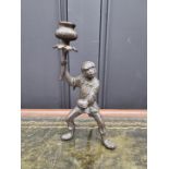 A bronze novelty monkey candlestick, 22cm high.