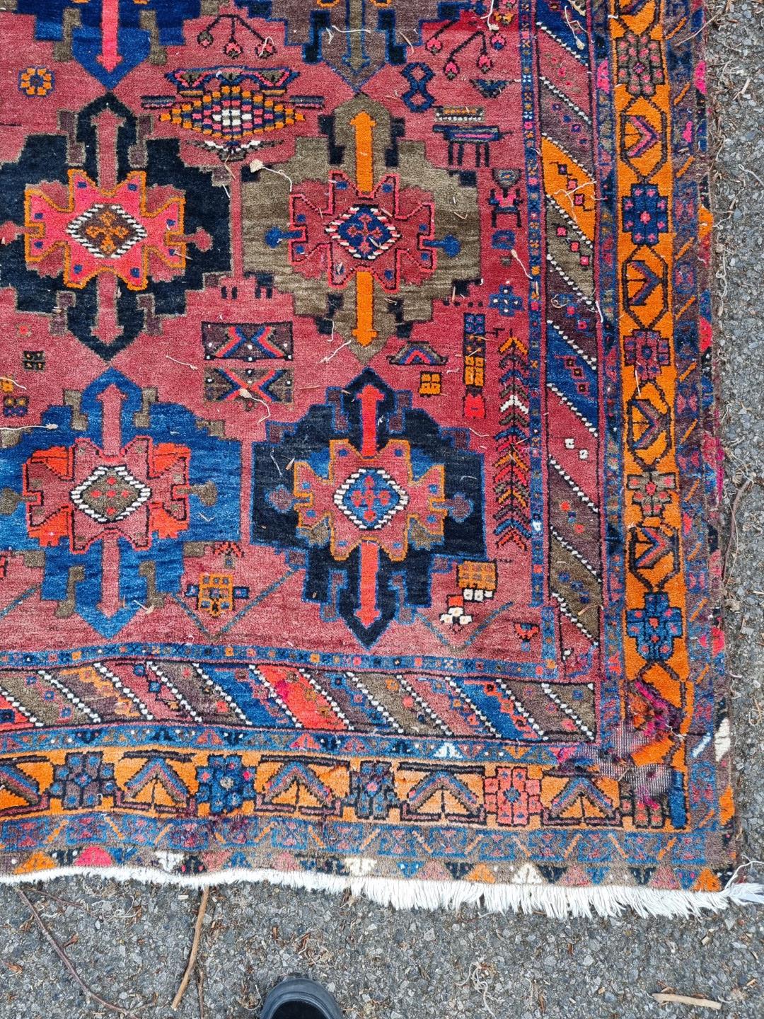 A Persian carpet, having central floral medallion, with floral decoration to central field, 392 x - Image 9 of 12