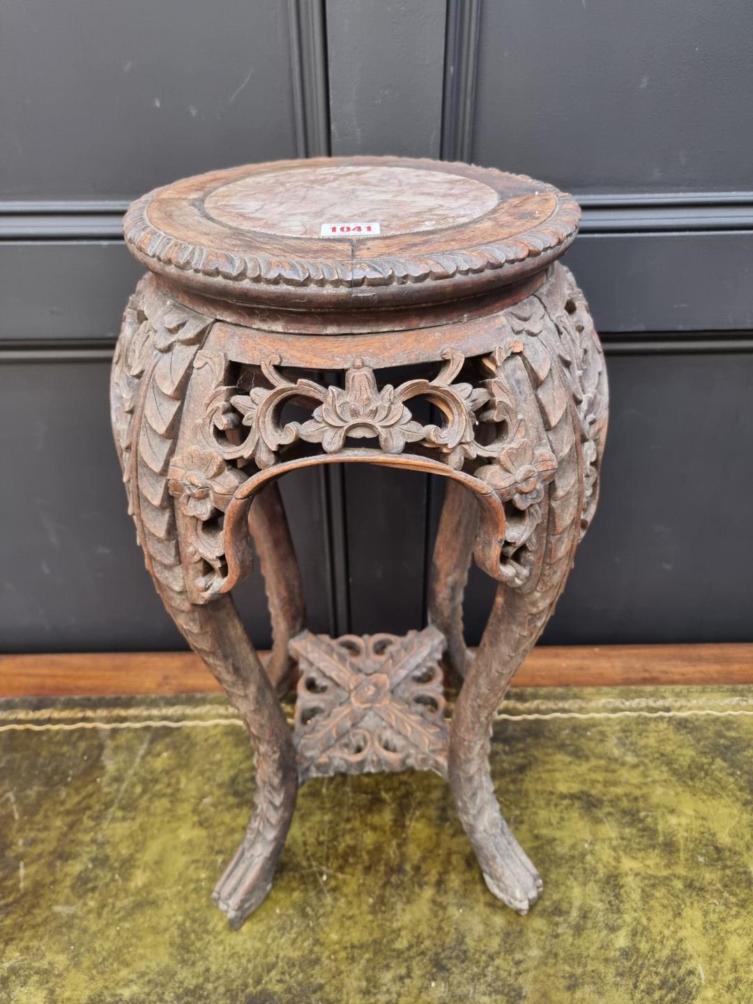 A Chinese carved hardwood and marble inset jardiniere stand, 61.5cm high.