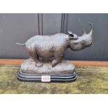 A bronze rhinoceros, bears signature, on marble base, 21cm high.