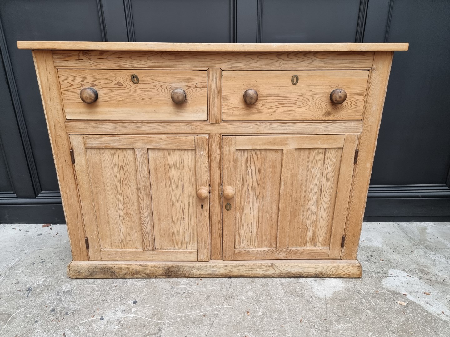 An old pine side cabinet, 128cm wide.