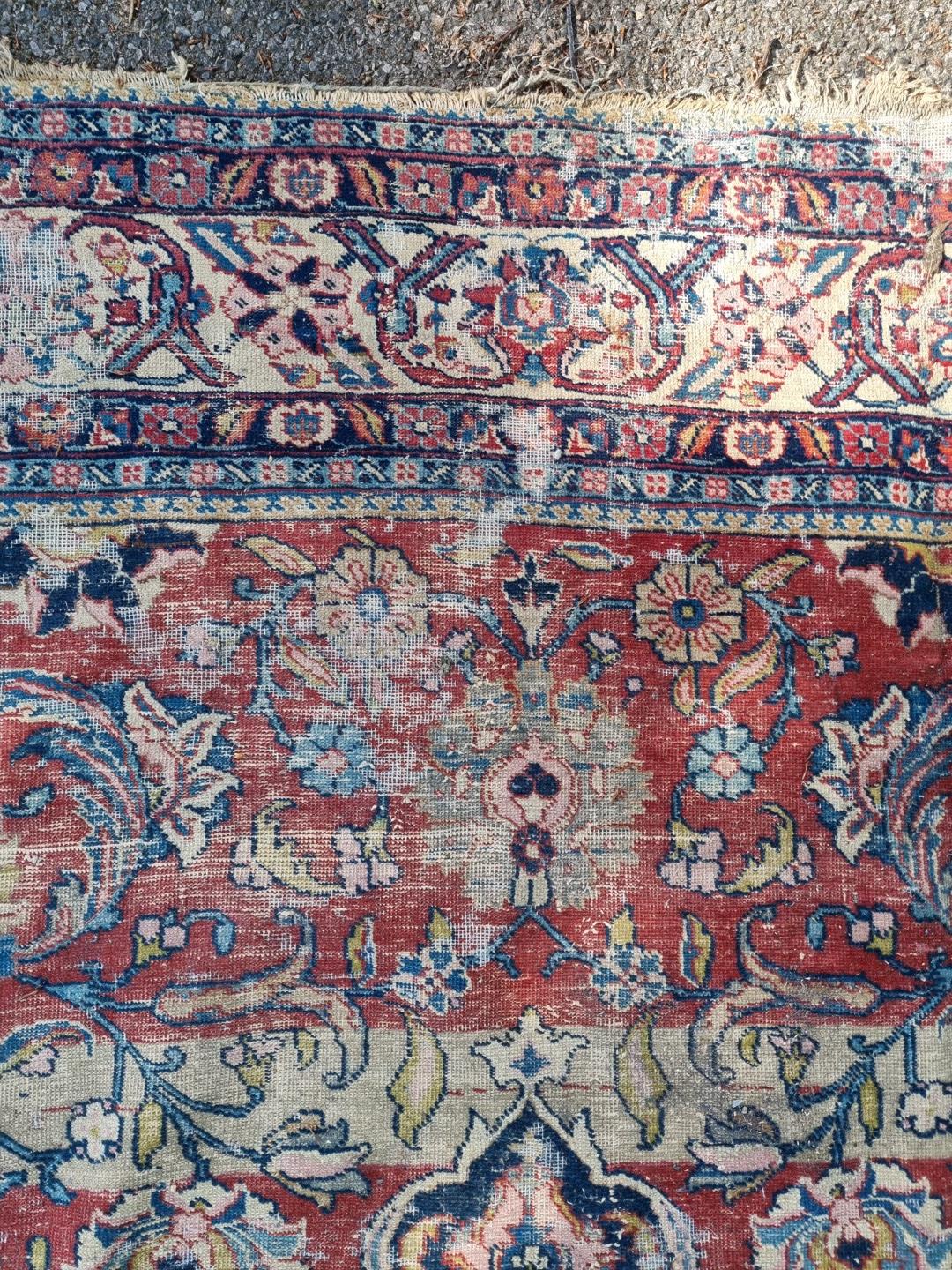 A Persian carpet, having central floral medallions, with floral cartouches to each corner of central - Image 6 of 10