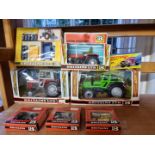 Britains: a group of vintage farm vehicles and accessories, comprising Nos: 9526, 9520, 9522, and