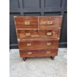 An old teak and brass bound campaign chest, in two parts, 91.5cm wide.