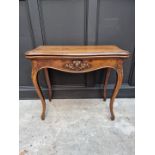 A Victorian walnut card table, of serpentine outline, 83cm wide.