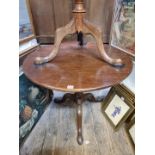 An 18th century mahogany circular tilt-top tripod table, with birdcage action and one piece top,