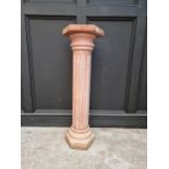 A pink marble pedestal, with hexagonal top & base and fluted column, 101.5cm high.