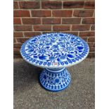 A blue and white porcelain circular conservatory table, 42cm high x 52.5cm wide.