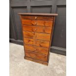 A stained pine semanier chest, 105cm high x 62.5cm wide.