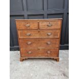 A George III oak and walnut banded chest of drawers, 96.5cm wide.