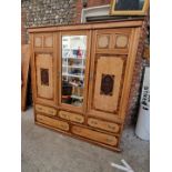 A late Victorian burr ash, rosewood, mahogany and carved triple wardrobe, by Maple & Co, 183.5cm