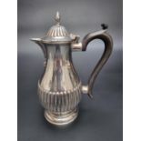 An Edwardian silver hot water jug, by George Nathan & Ridley Hayes, Chester 1906, 20cm high, gross