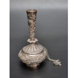 An Indian white metal rosewater sprinkler, having repousse decoration of exotic animals amongst