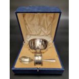 A cased silver Christening set, comprising bowl, fork and napkin ring, by Walker & Hall Ltd,